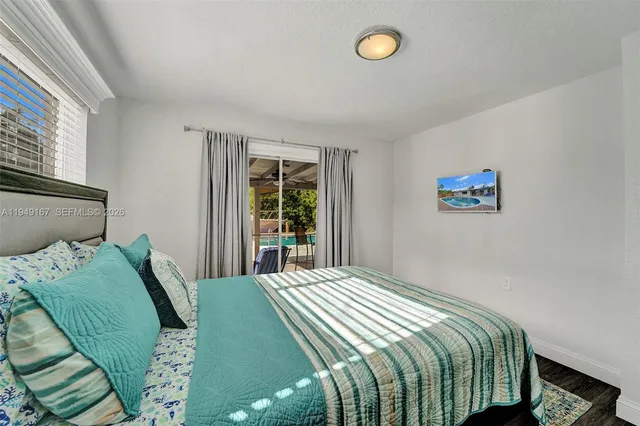 a kitchen with stainless steel appliances a refrigerator sink and cabinets