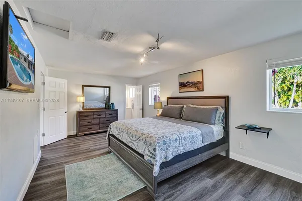 an aerial view of a house with a lake view