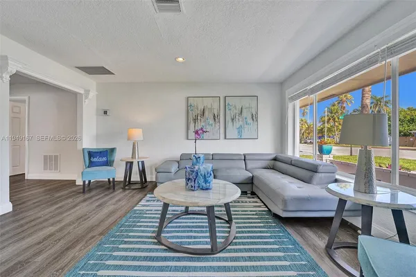 a living room with furniture and a window