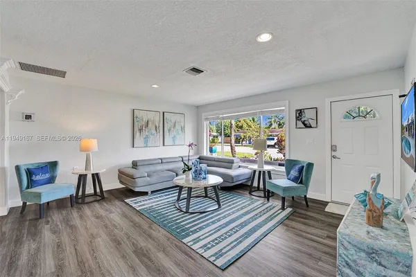a living room with furniture and a table