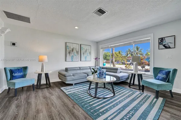 a living room with a bed and a couch