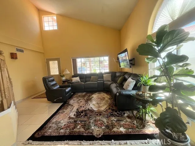 a living room with furniture and a rug