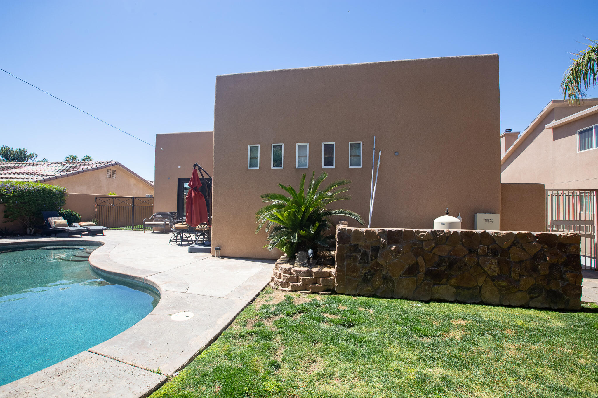 66862 San Rafael Road Desert Hot Springs, CA 92240 - Photo 13 of 33 a view of a house with backyard and sitting area