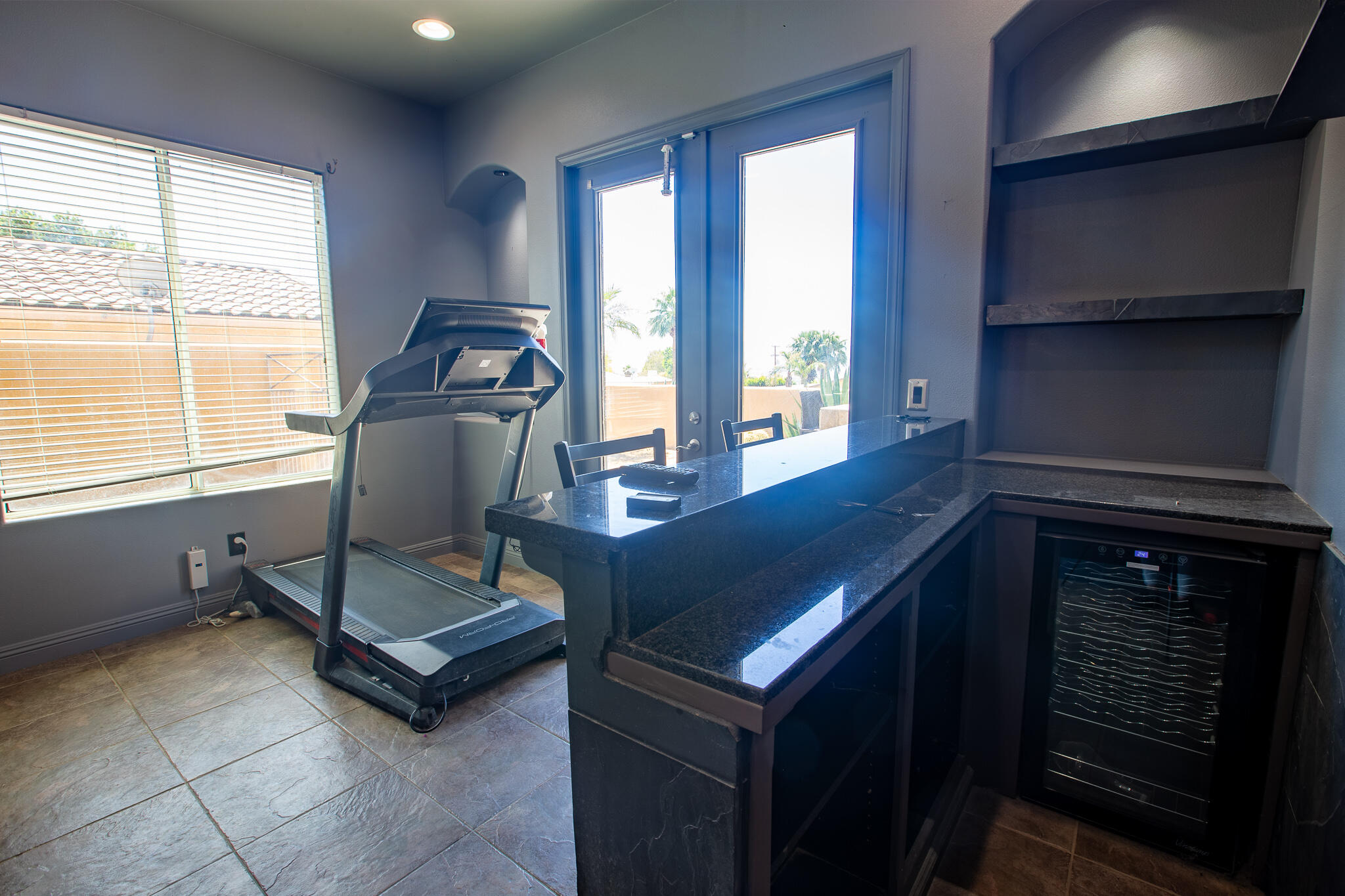 66862 San Rafael Road Desert Hot Springs, CA 92240 - Photo 17 of 33 a living room with a table chairs and a window