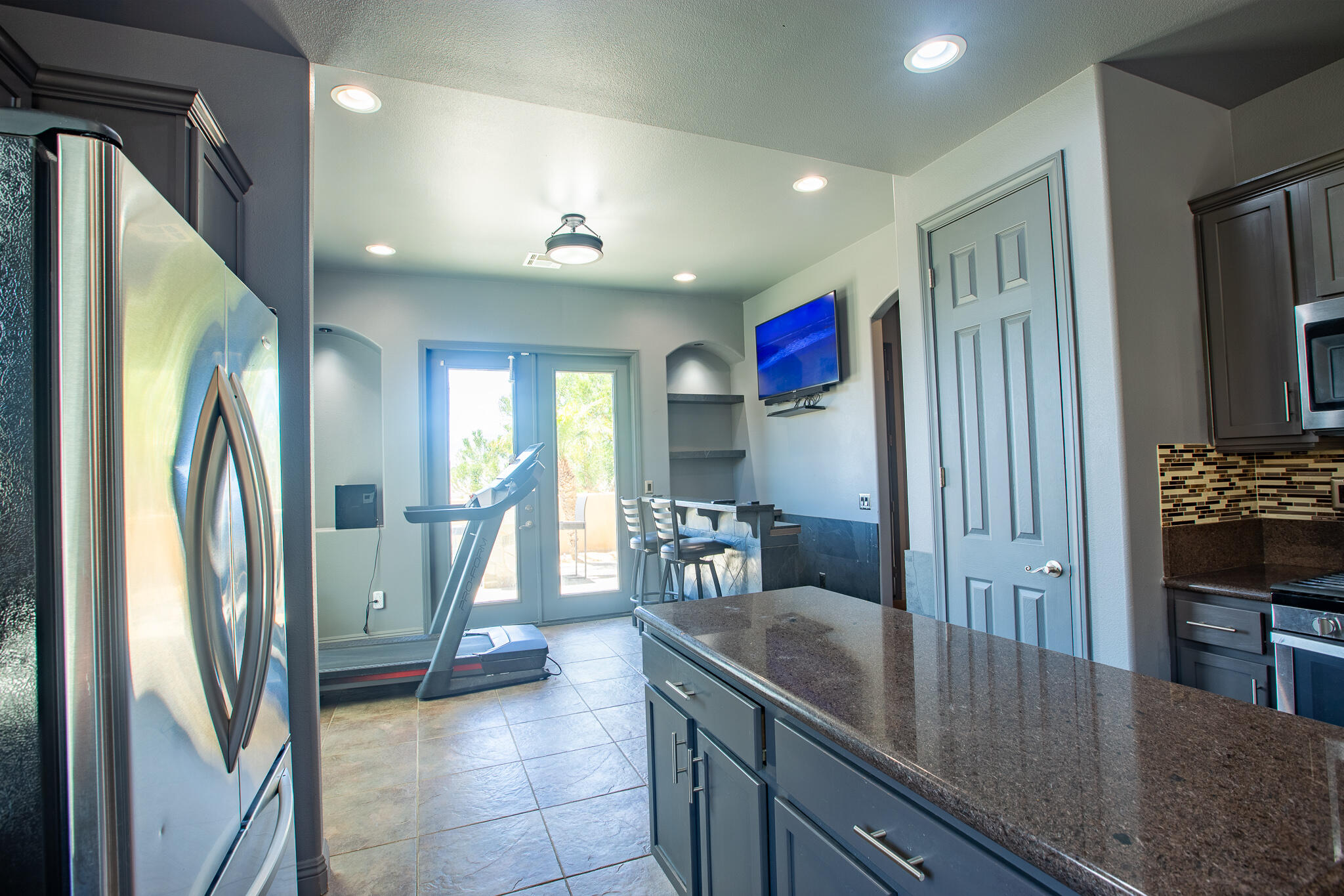 66862 San Rafael Road Desert Hot Springs, CA 92240 - Photo 18 of 33 a kitchen with stainless steel appliances granite countertop a refrigerator a sink and a stove
