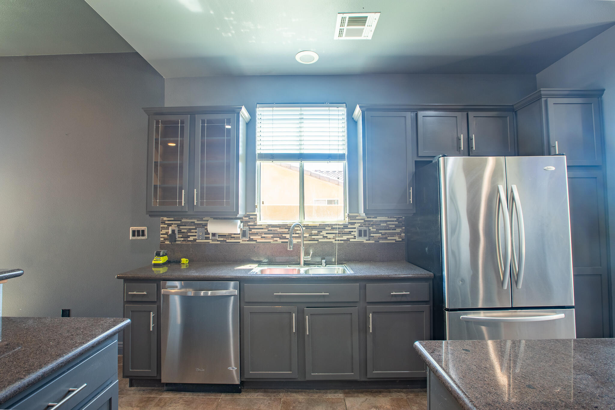 66862 San Rafael Road Desert Hot Springs, CA 92240 - Photo 19 of 33 a kitchen with stainless steel appliances granite countertop a sink and a refrigerator