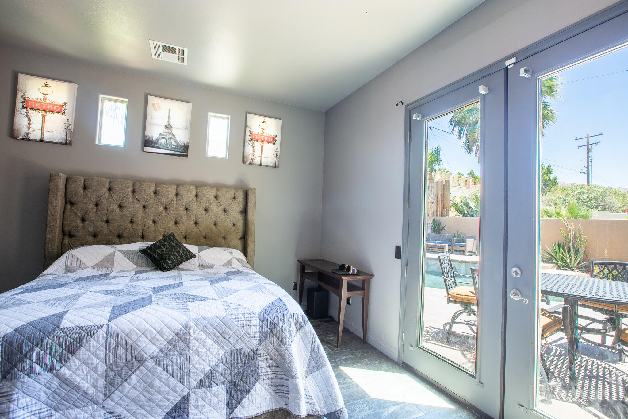 66862 San Rafael Road Desert Hot Springs, CA 92240 - Photo 23 of 33 a bedroom with a large bed and a window
