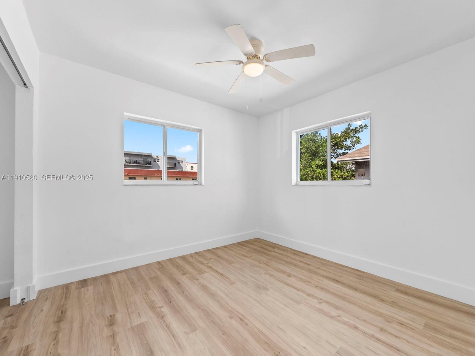 300 Northwest 7th Avenue, Unit 1 Miami, FL 33128 - Photo 6 of 10 a view of a room with wooden floor and window