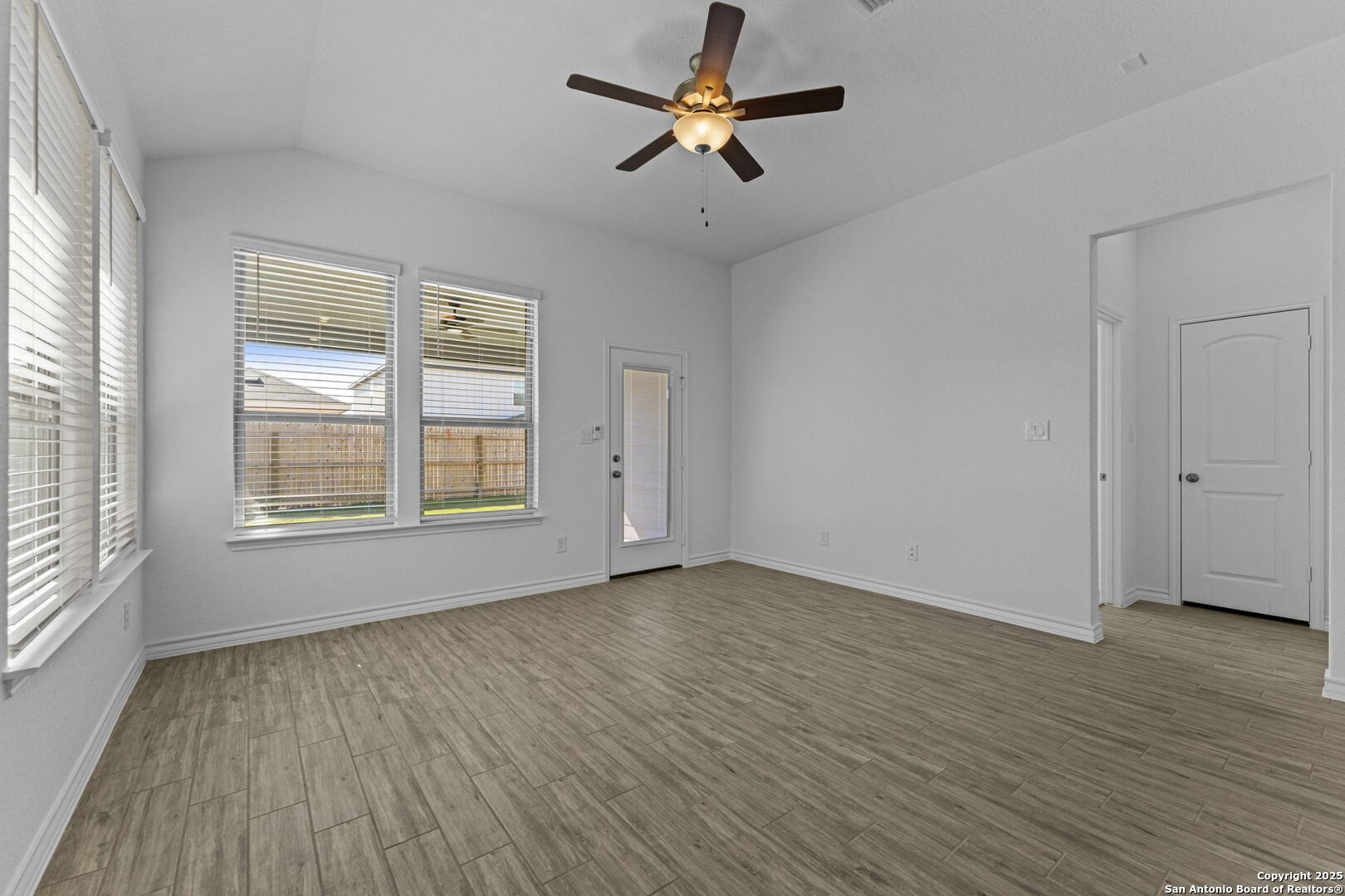 4040 Paddock Trail Seguin, TX 78155 - Photo 16 of 26 a view of empty room with wooden floor and fan