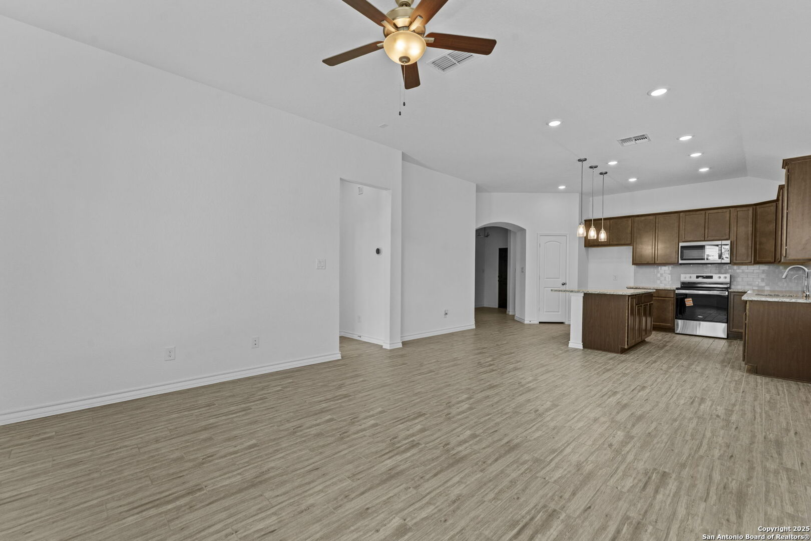 4040 Paddock Trail Seguin, TX 78155 - Photo 18 of 26 a view of a kitchen with a sink and a refrigerator