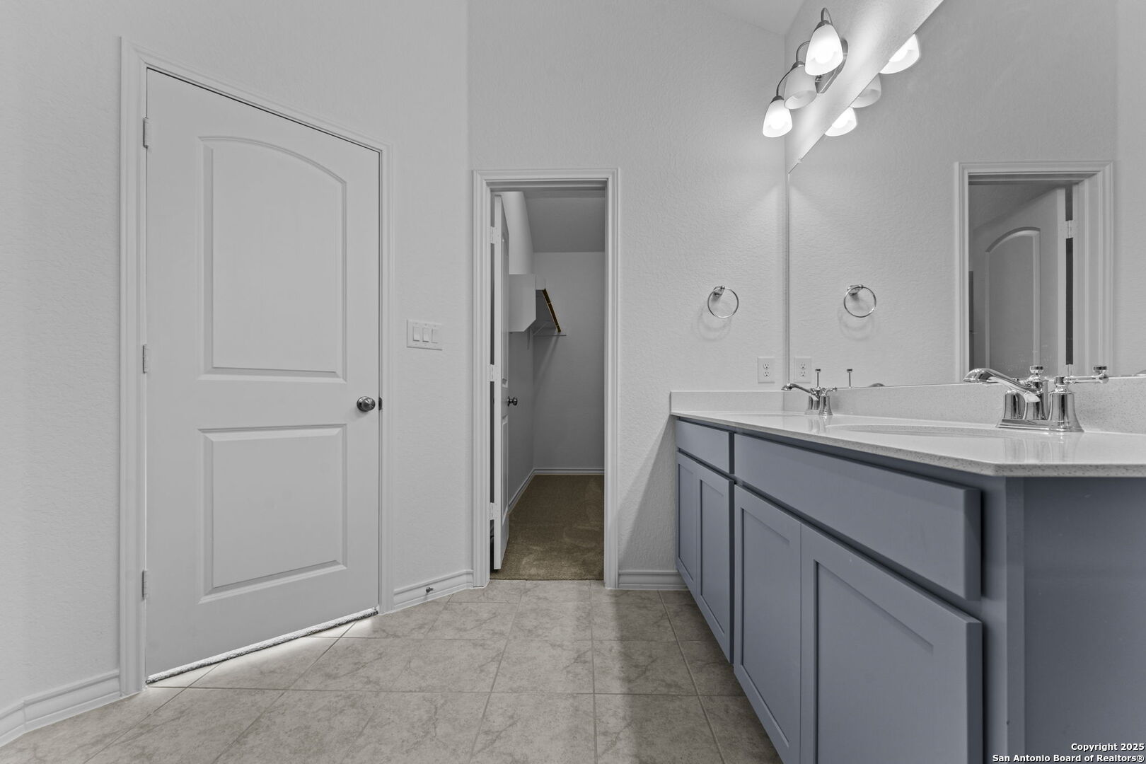 4040 Paddock Trail Seguin, TX 78155 - Photo 23 of 26 a bathroom with a double vanity sink a and a mirror