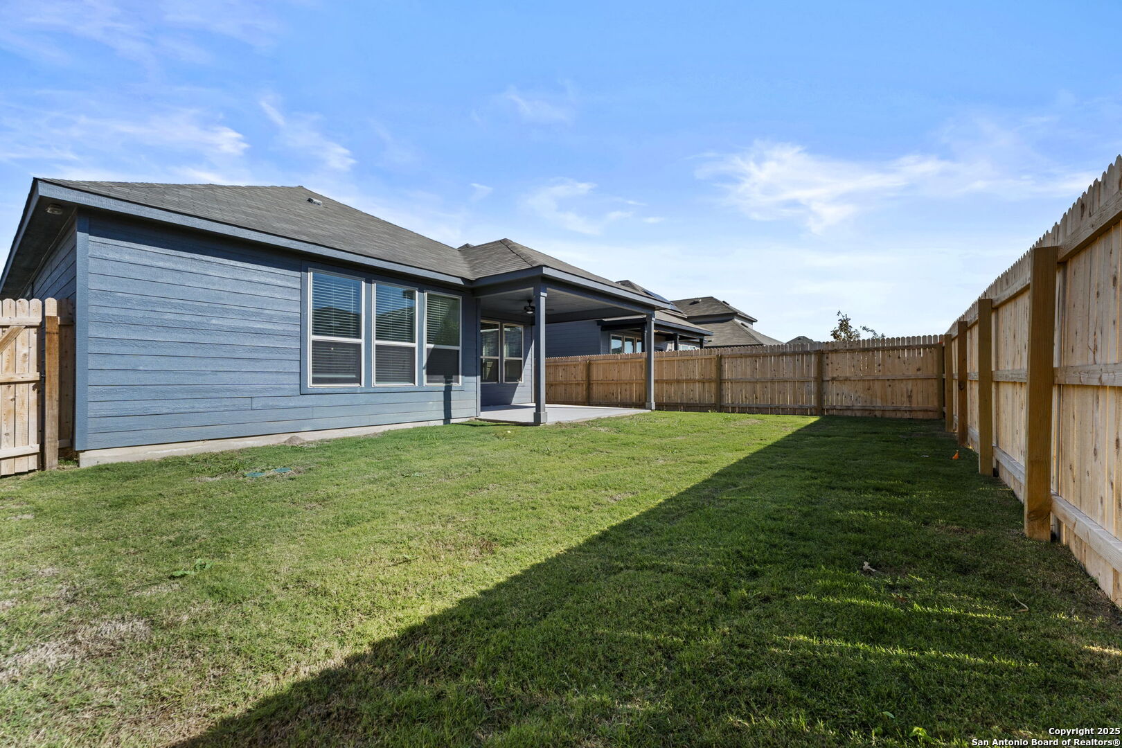 4040 Paddock Trail Seguin, TX 78155 - Photo 25 of 26 a view of a backyard with wooden fence
