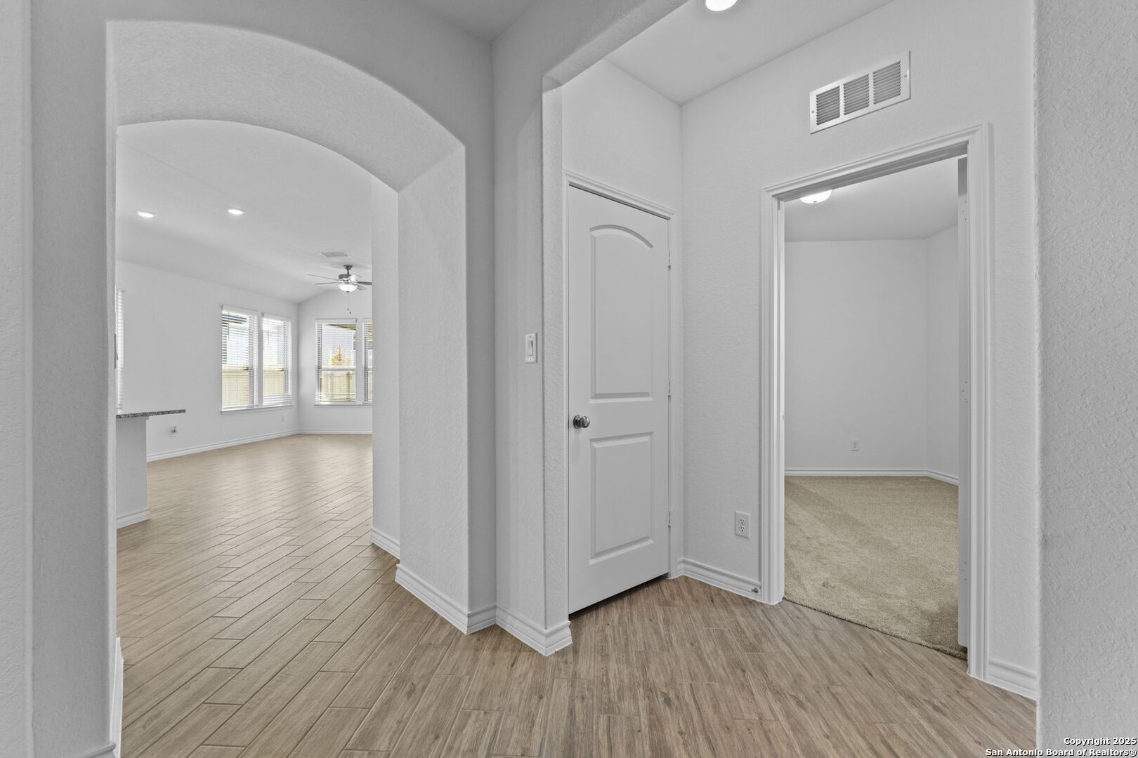 4040 Paddock Trail Seguin, TX 78155 - Photo 3 of 26 a view of livingroom with hardwood floor and hallway