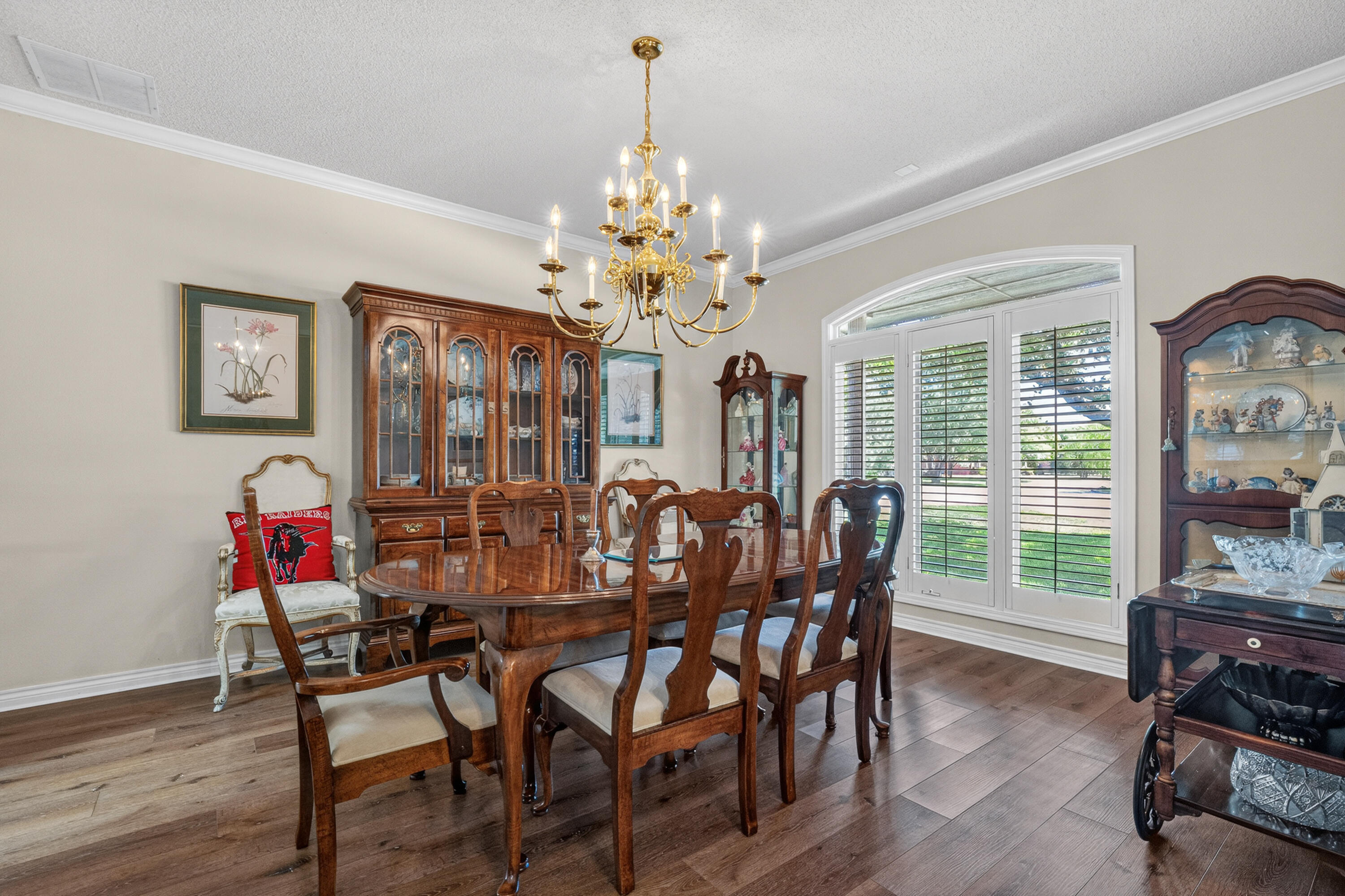 7402 95th Street Lubbock, TX 79424 - Photo 11 of 43 a view of a dining room with furniture window and wooden floor