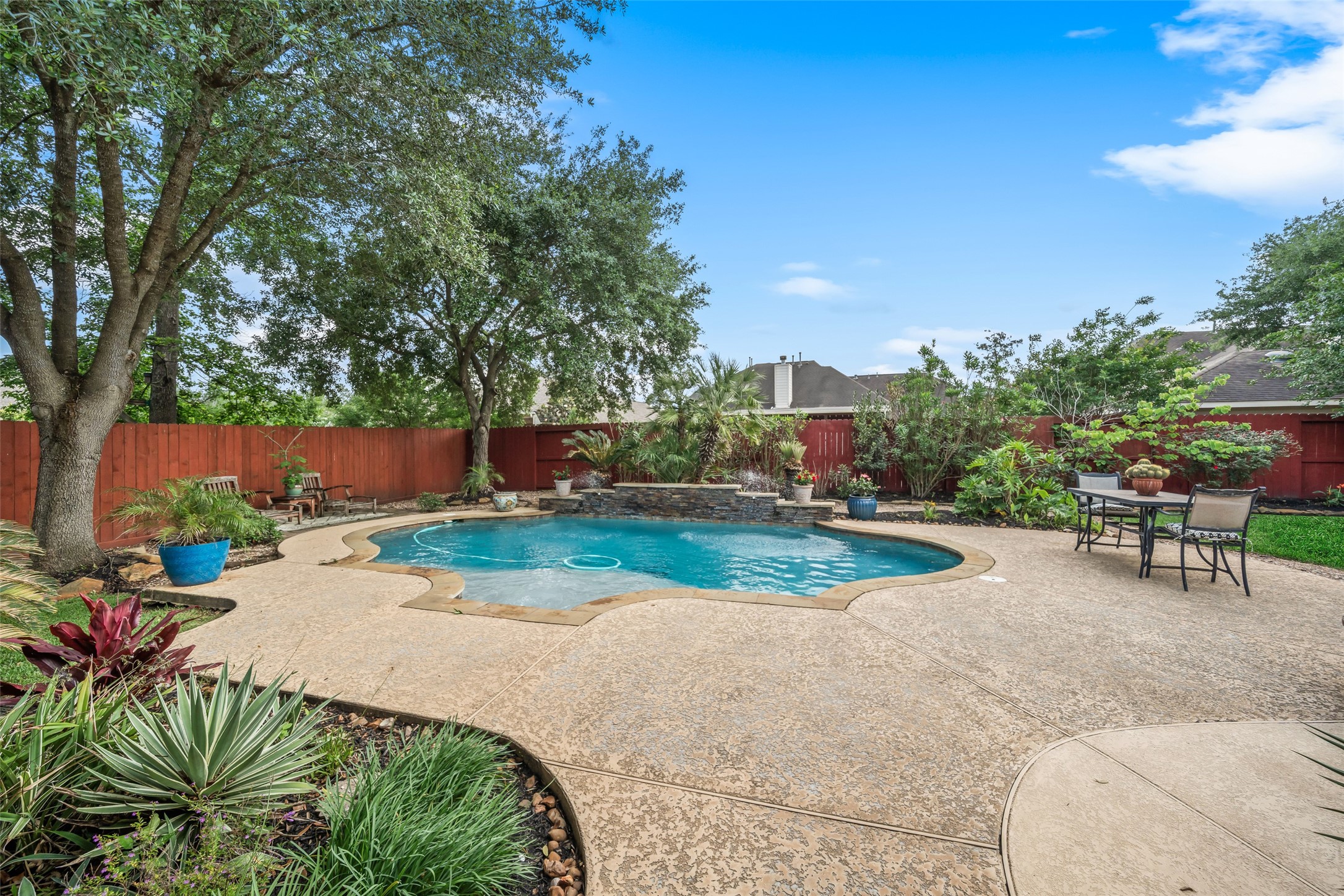 6407 Ashley Manor Drive Spring, TX 77389 - Photo 34 of 41 a backyard of a house with table and chairs