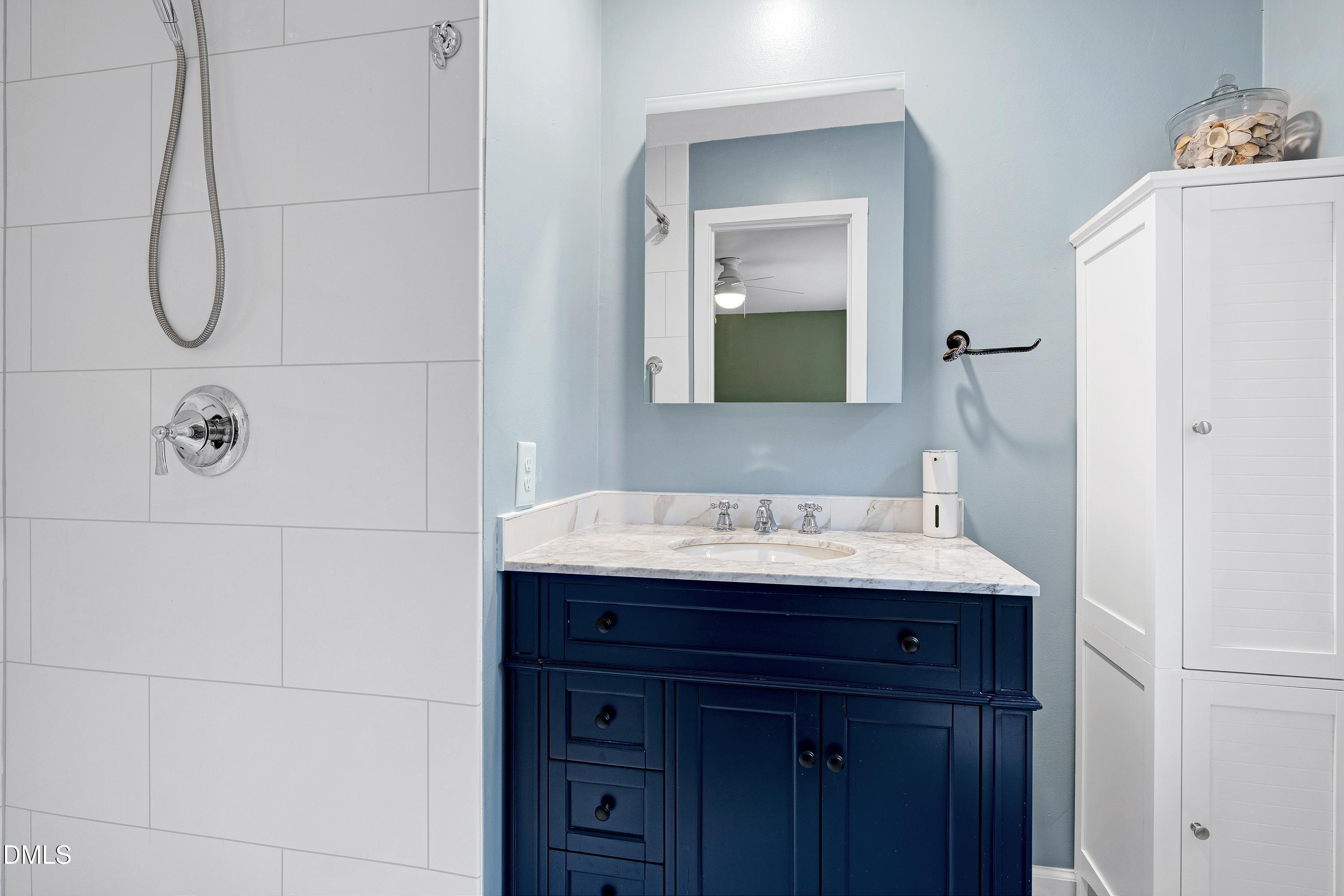 5817 Newhall Road Durham, NC 27713 - Photo 23 of 51 Replacement vanity and fixxtures, medicine cabinet