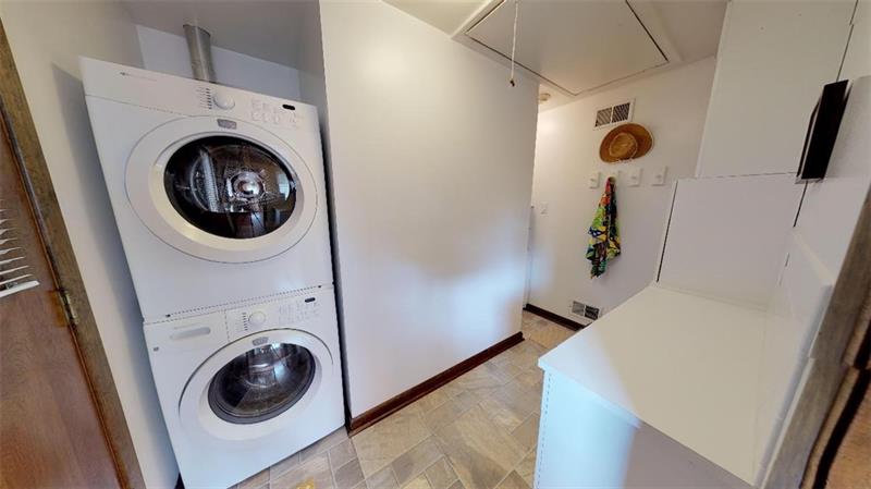 48 May Avenue McKees Rocks, PA 15136 - Photo 7 of 16 Main floor laundry with wash tub and storage, washer and dryer stay with home!