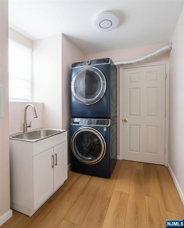 346 Alan Drive Paramus, NJ 07652 - Photo 12 of 21 a view of a storage and utility room with washer and dryer