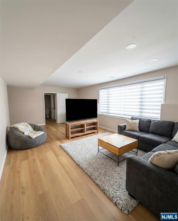 346 Alan Drive Paramus, NJ 07652 - Photo 13 of 21 a bedroom with furniture and a flat screen tv