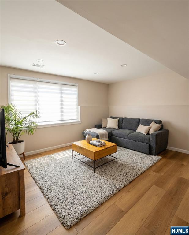 346 Alan Drive Paramus, NJ 07652 - Photo 14 of 21 a living room with furniture and a flat screen tv