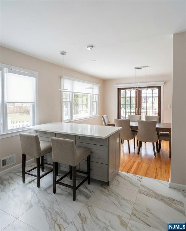 346 Alan Drive Paramus, NJ 07652 - Photo 17 of 21 a dining room with wooden floor and breakfast area