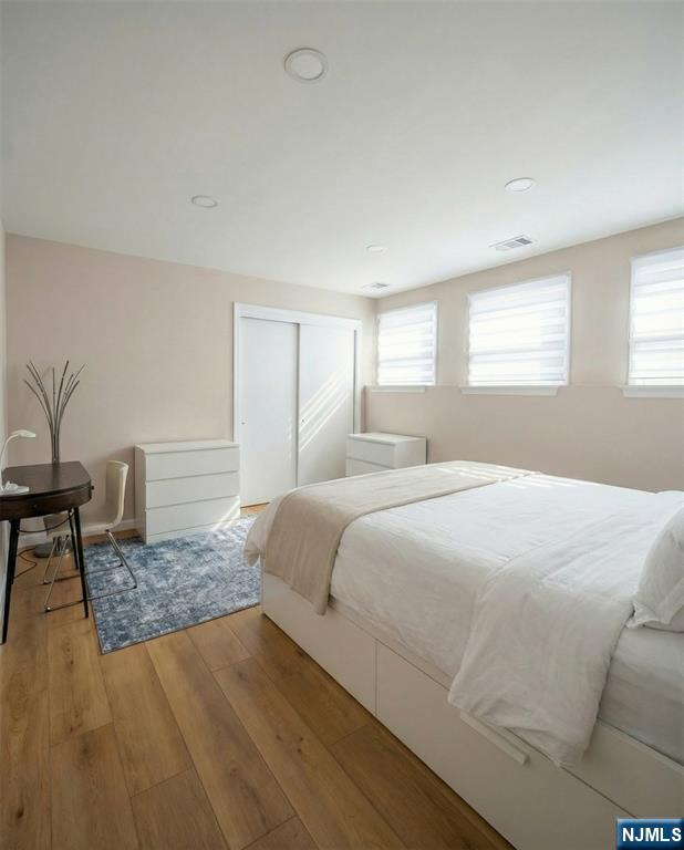 346 Alan Drive Paramus, NJ 07652 - Photo 19 of 21 a bedroom with a bed and a table in it