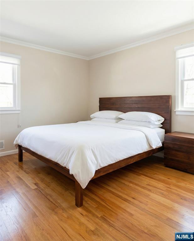 346 Alan Drive Paramus, NJ 07652 - Photo 21 of 21 a bedroom with a bed and window