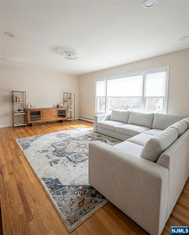 346 Alan Drive Paramus, NJ 07652 - Photo 7 of 21 a living room with furniture and a open kitchen