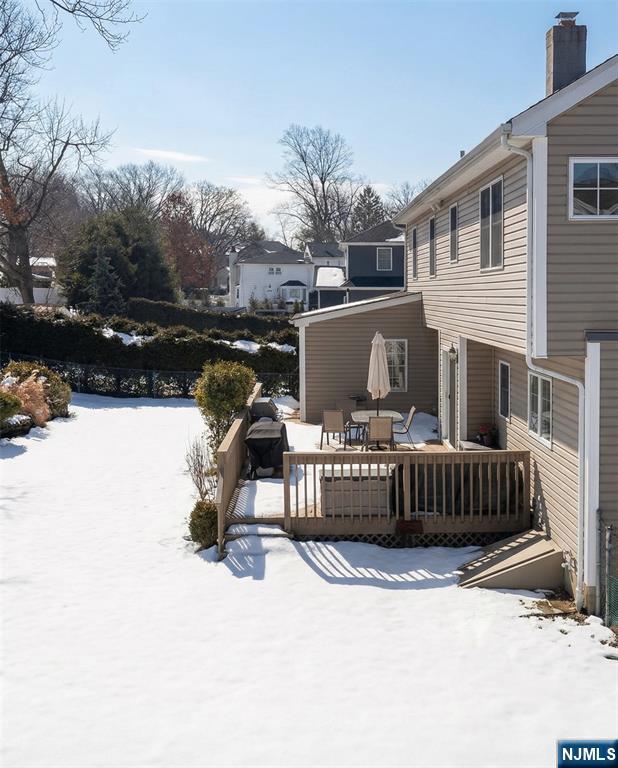 346 Alan Drive Paramus, NJ 07652 - Photo 10 of 21 a view of a roof deck with couches and wooden floor