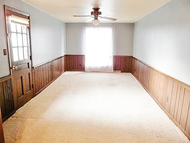 1016 McGovern Road Houston, PA 15342 - Photo 14 of 25 Freshly painted First Floor Family Room with paddle fan with lighting fixture. Long large window lets in lots of sunshine and the door to the left leads to the back patio. So much extra space in this home!