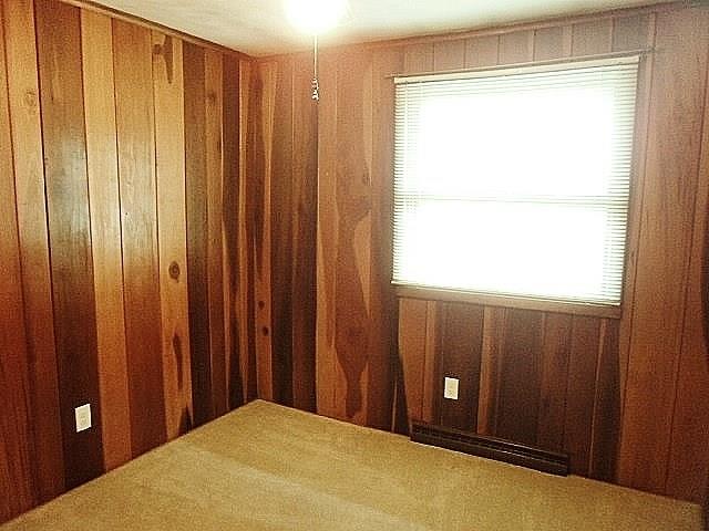 1016 McGovern Road Houston, PA 15342 - Photo 21 of 25 Third bedroom or Den with real wood paneling and paddle fan with lighting fixture. All window treatments throughout the home stay.