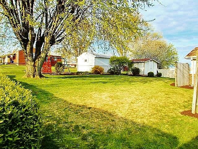 1016 McGovern Road Houston, PA 15342 - Photo 5 of 25 Big tree to give you just the right amount of shade on those lazy hot summer days in your level backyard! Garden shed with nice landscaping also!