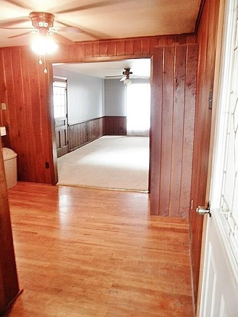 1016 McGovern Road Houston, PA 15342 - Photo 8 of 25 Open Dining area with Hardwood Flooring, paddle fan with lighting fixture and real knotty pine paneling, photo from Living rm through to Kitchen & Family Room.
