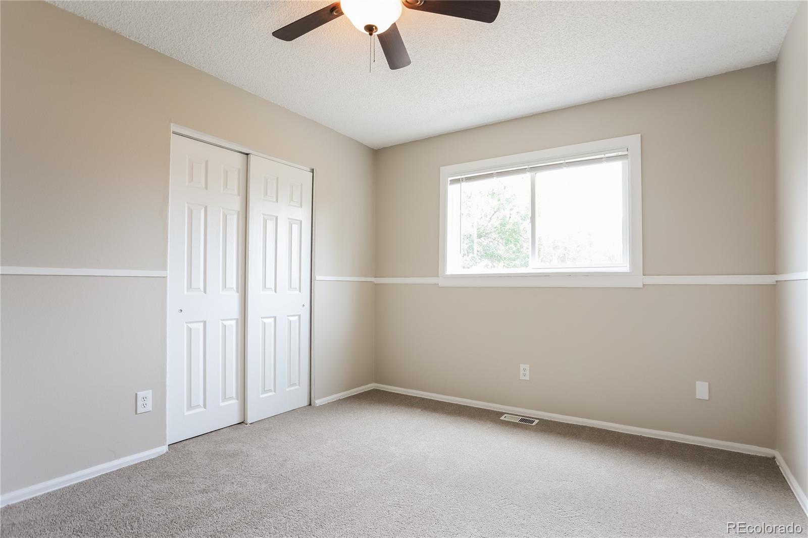11580 East Ada Place Aurora, CO 80012 - Photo 11 of 18 an empty room with a window