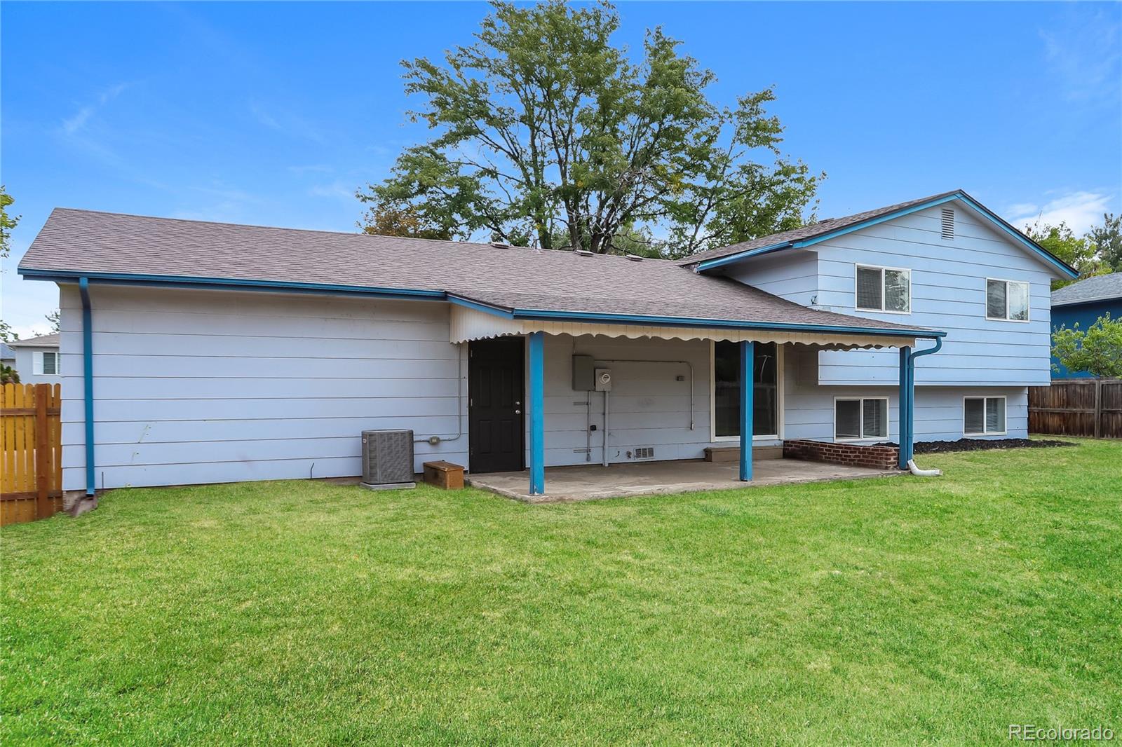 11580 East Ada Place Aurora, CO 80012 - Photo 14 of 18 a front view of a house with a garden