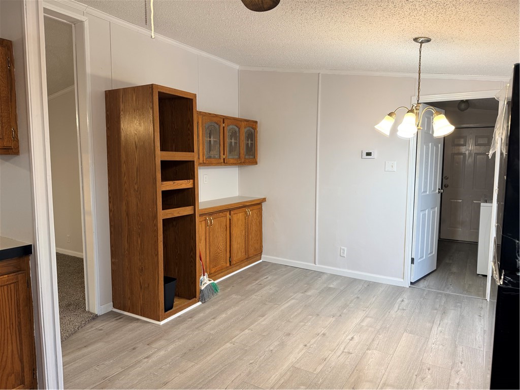 307 West 7th Street St. Elmo, IL 62458 - Photo 9 of 17 a view of empty room with wooden floor