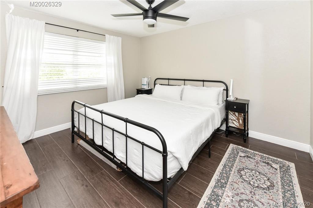 945 Sunset Road West Palm Beach, FL 33401 - Photo 24 of 31 a bedroom with a bed and window