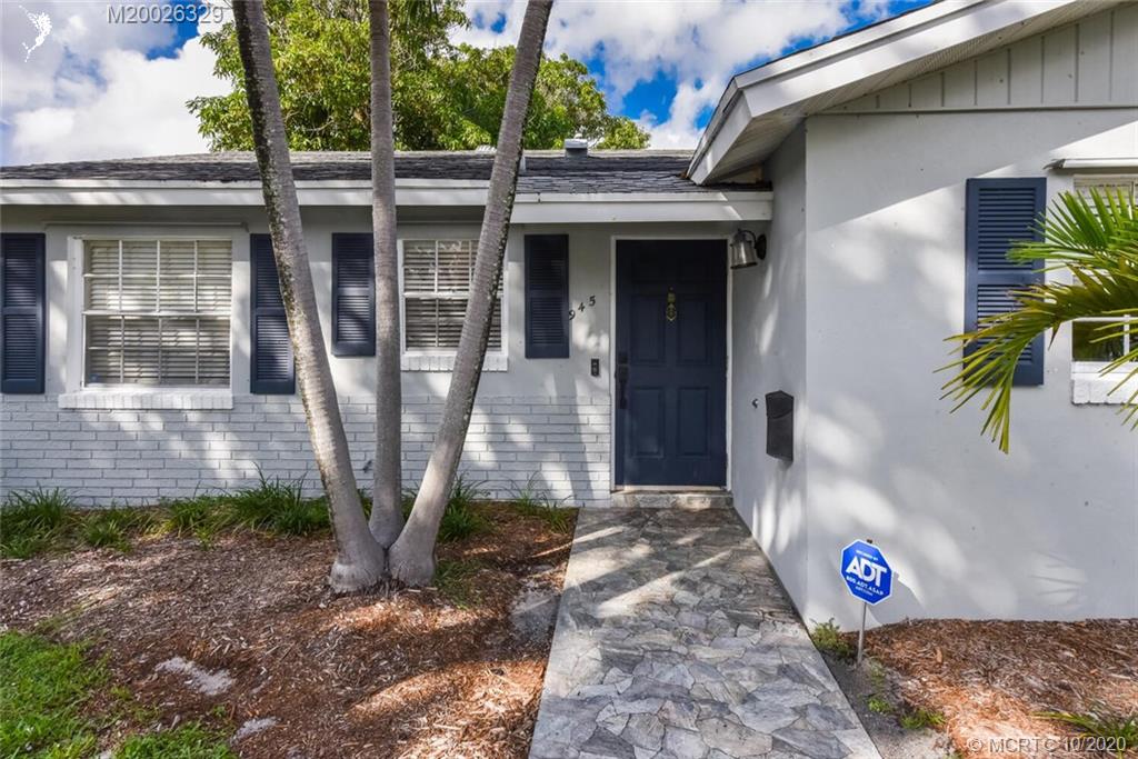 945 Sunset Road West Palm Beach, FL 33401 - Photo 4 of 31 a front view of a house