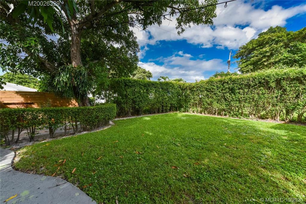 945 Sunset Road West Palm Beach, FL 33401 - Photo 6 of 31 a view of yard with swimming pool and green space