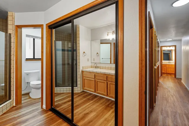 a bathroom with a shower and a sink