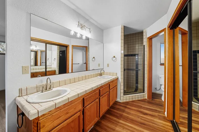 a spacious bathroom with a sink and a mirror