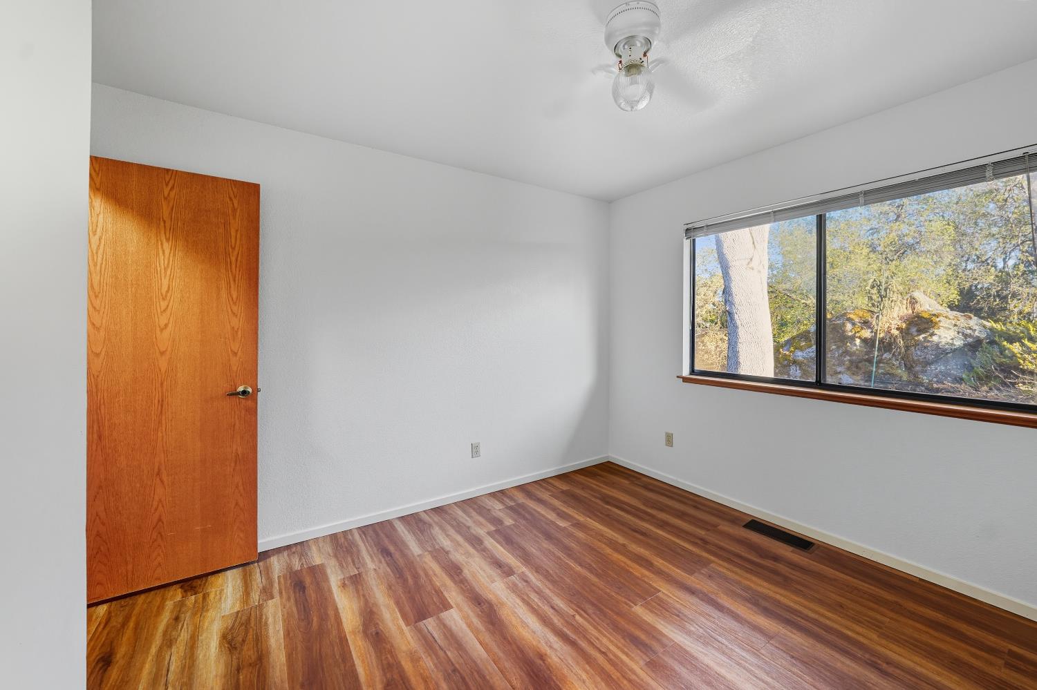 11585 Linnet Court Penn Valley, CA 95946 - Photo 18 of 49 wooden floor in an empty room with a window