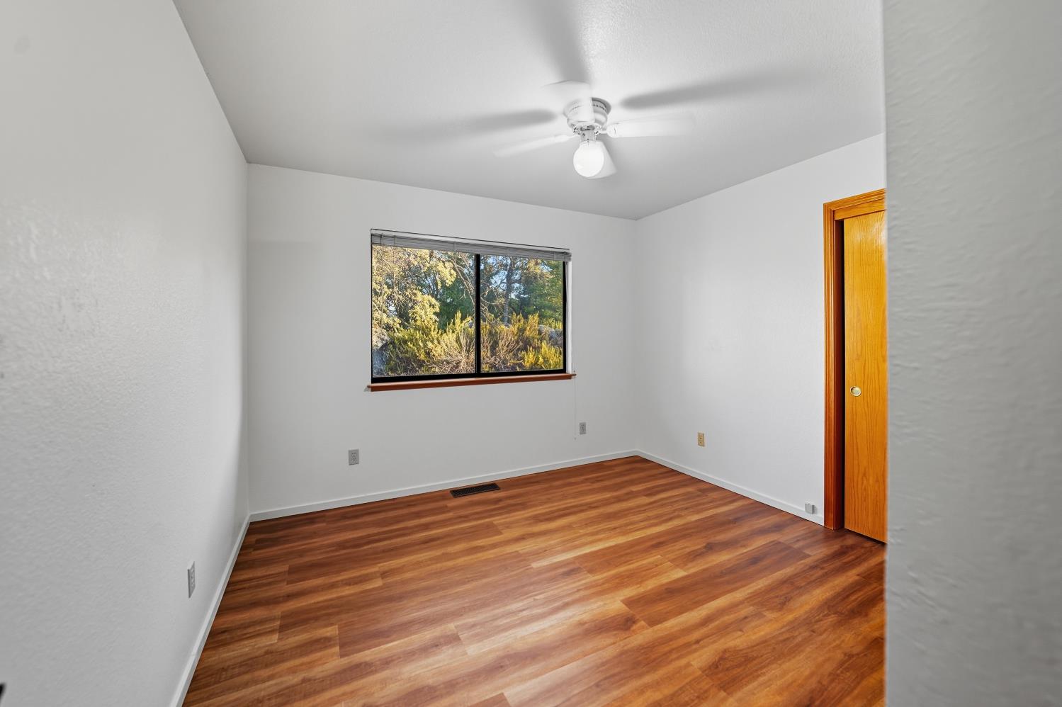 11585 Linnet Court Penn Valley, CA 95946 - Photo 23 of 53 a view of empty room with wooden floor