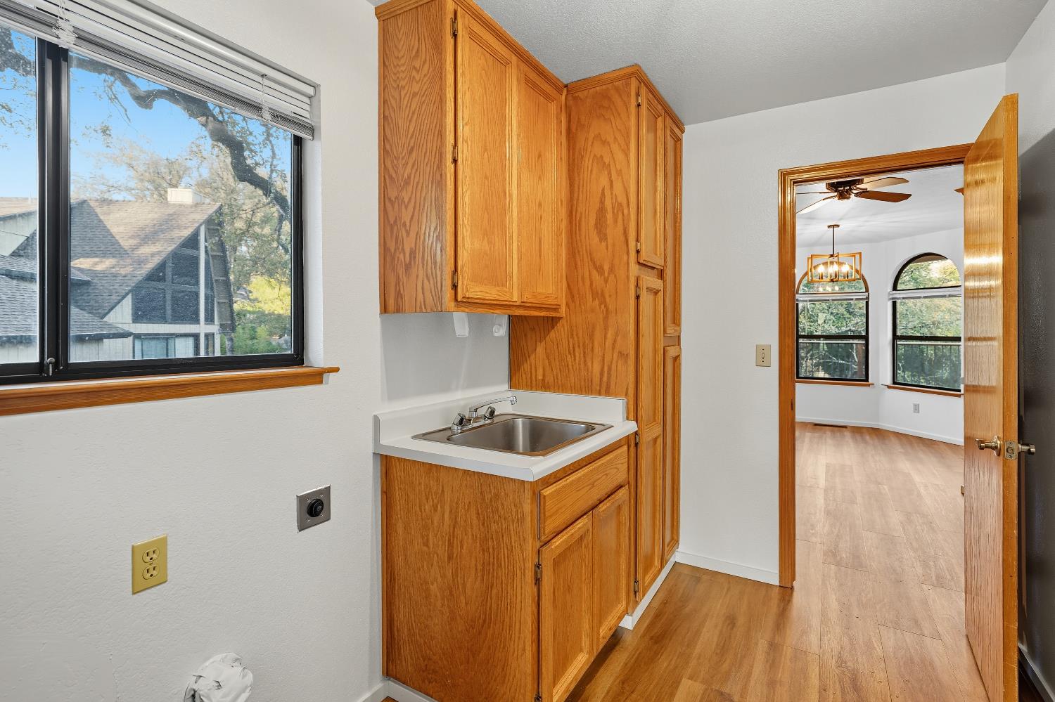 11585 Linnet Court Penn Valley, CA 95946 - Photo 26 of 53 a kitchen with a wooden floor and a window
