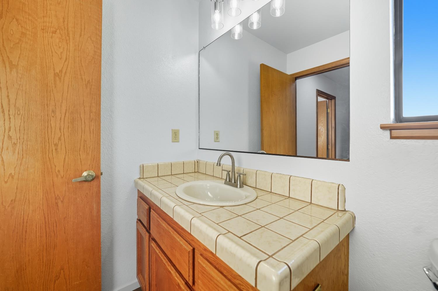 11585 Linnet Court Penn Valley, CA 95946 - Photo 27 of 53 a bathroom with a sink and a mirror