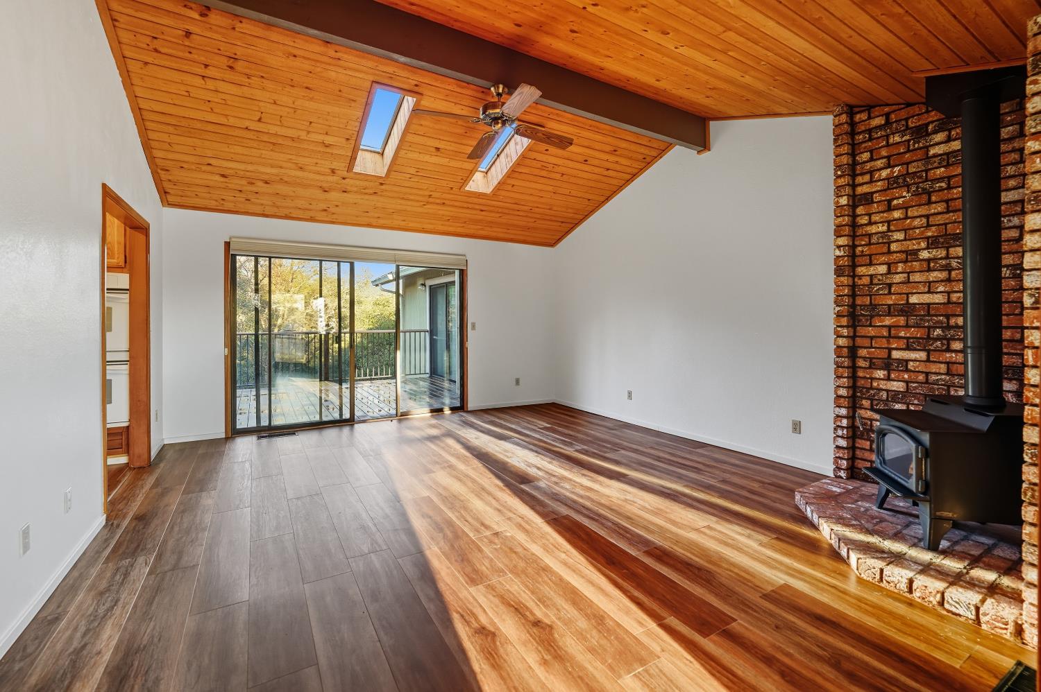 11585 Linnet Court Penn Valley, CA 95946 - Photo 3 of 53 a view of a room with wooden floor and windows