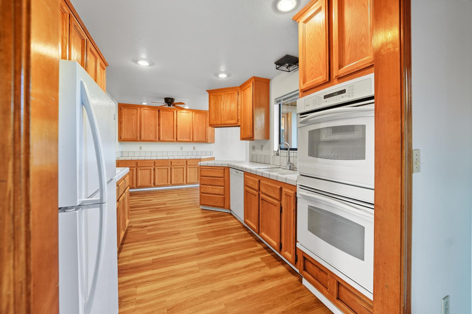 11585 Linnet Court Penn Valley, CA 95946 - Photo 10 of 53 a kitchen with stainless steel appliances granite countertop a refrigerator and a sink