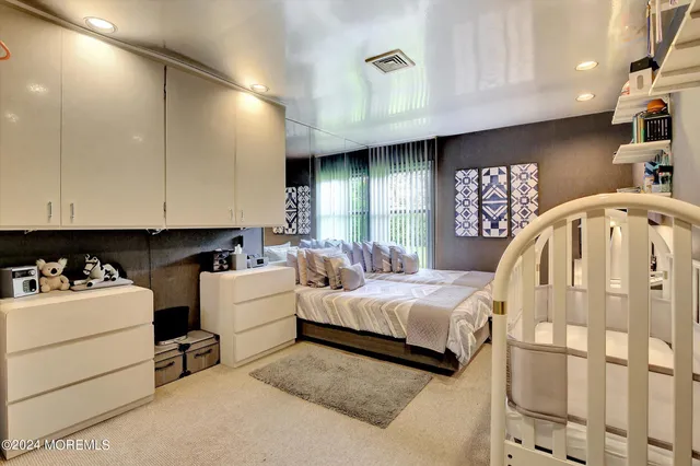 a living room with a bed and furniture