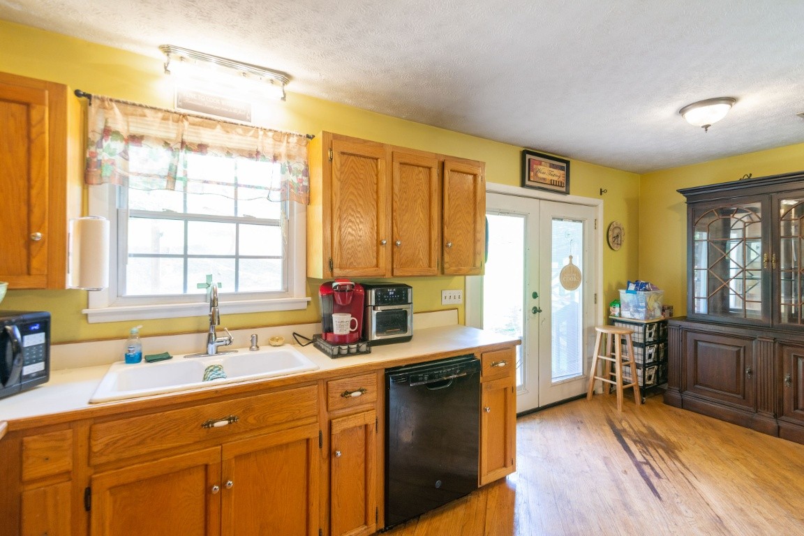 739 Thompson Road Pegram, TN 37143 - Photo 11 of 35 a kitchen with stainless steel appliances granite countertop a sink and cabinets