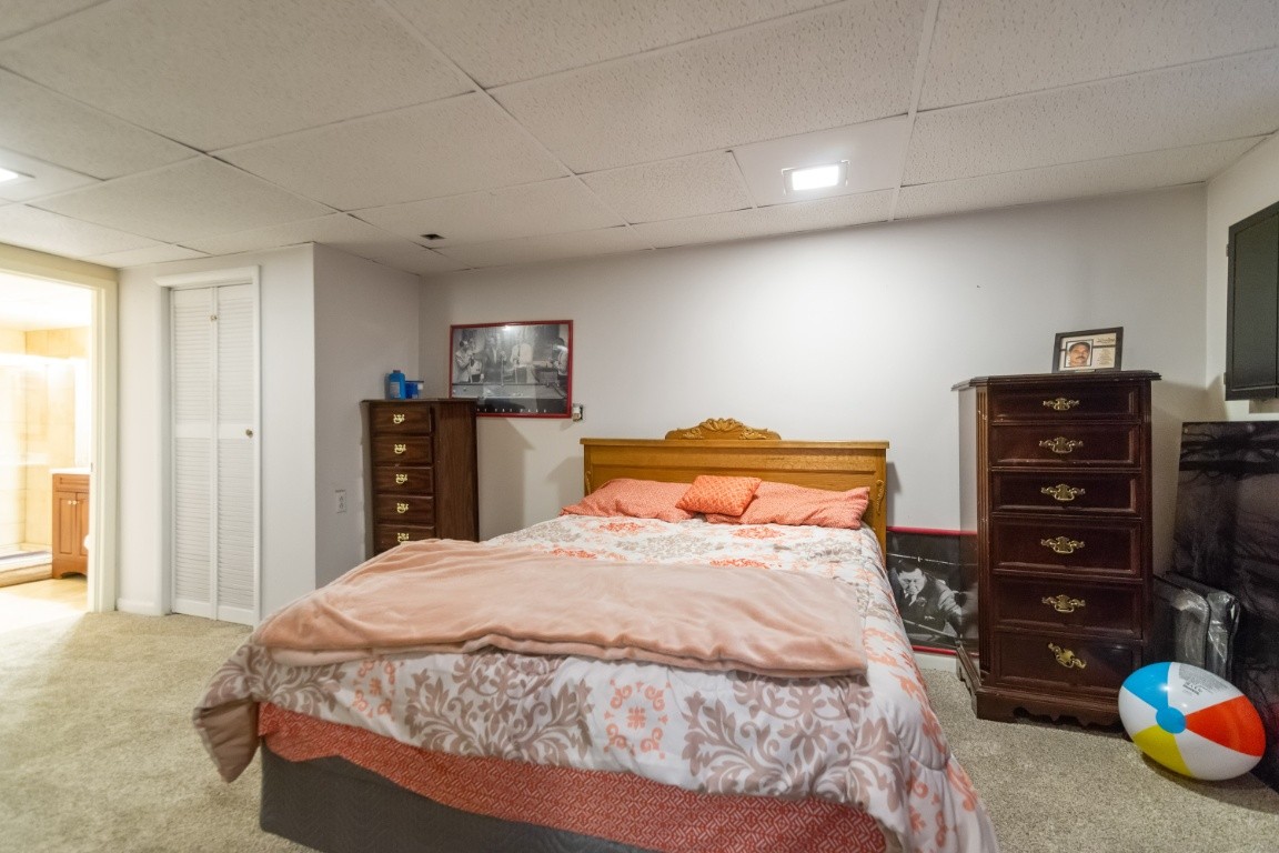 739 Thompson Road Pegram, TN 37143 - Photo 19 of 35 a bedroom with a bed and dresser
